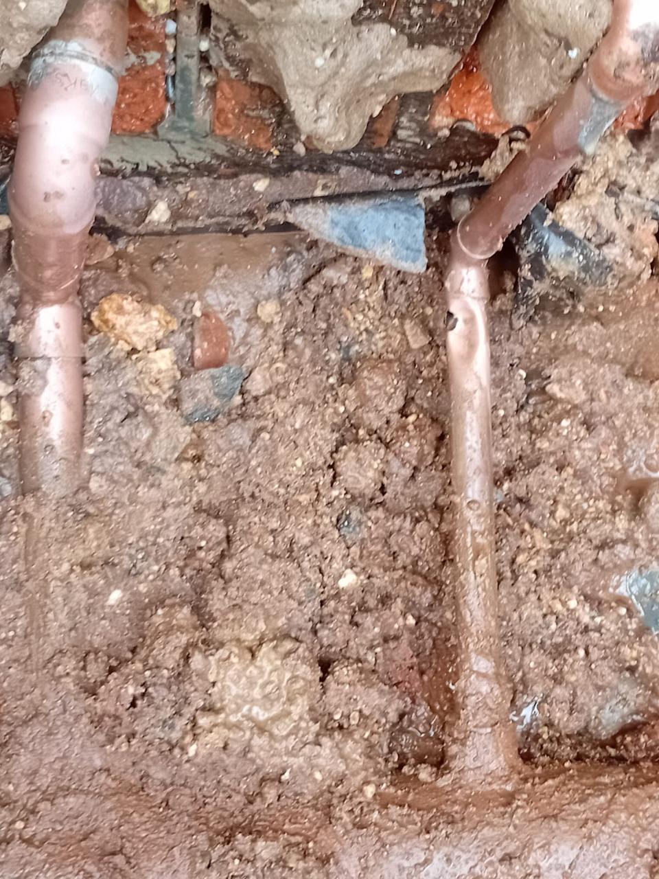 Underground drainage pipe exposed during repair work